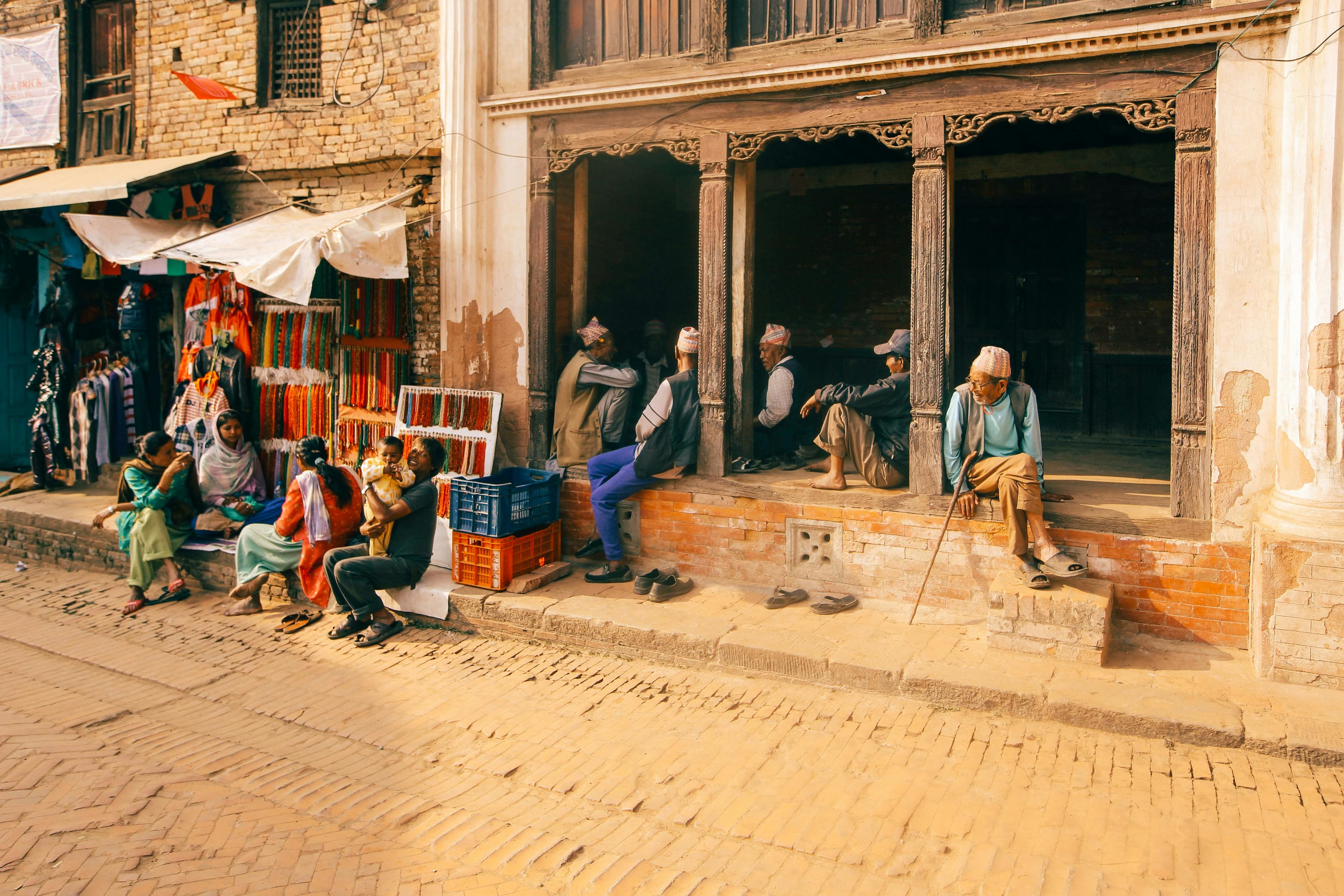 People gathered along a neighborhood street in an Indian city