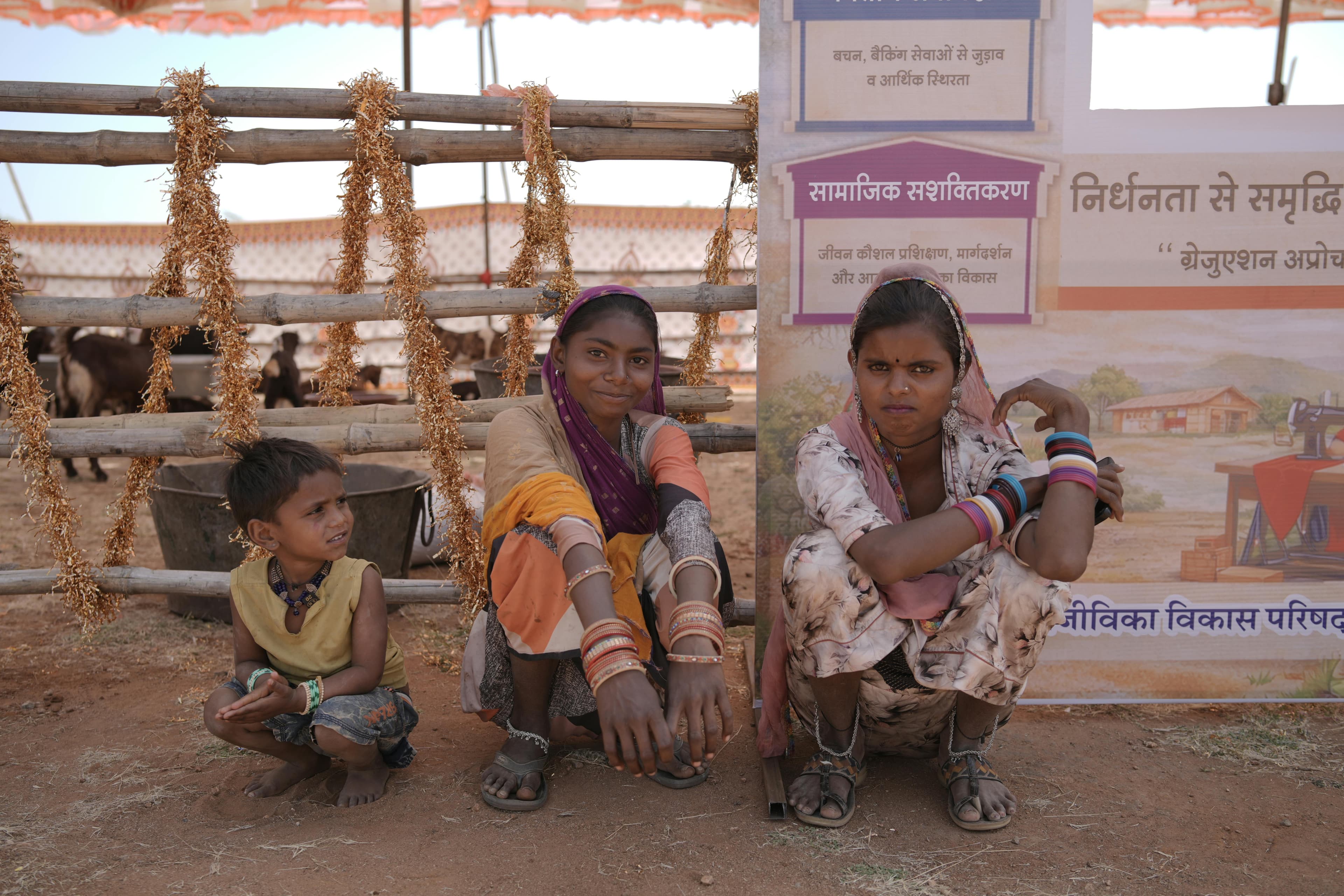 Families gathered at a rural community event in an Indian village